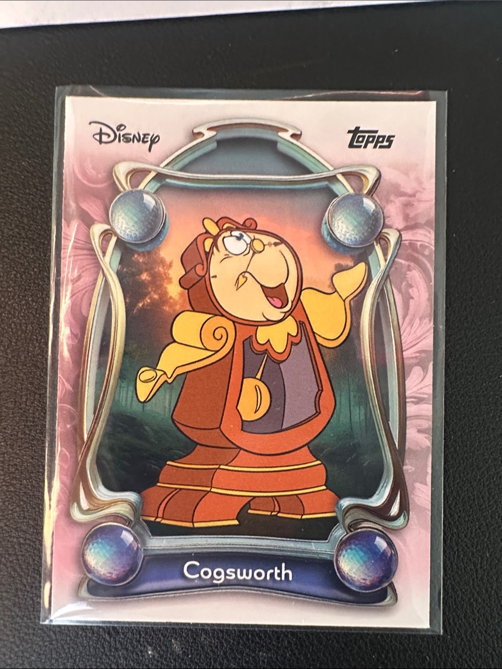 Topps Disney Cogsworth Trading Card - Pink and Orange Accents
